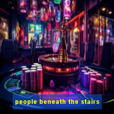 people beneath the stairs